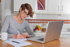woman-working-blogging-home-office-glasses-laptop-40727965